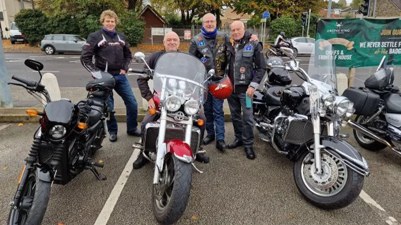 Members of the Widows Sons Masonic Bikers Association in their leathers with their bikes.