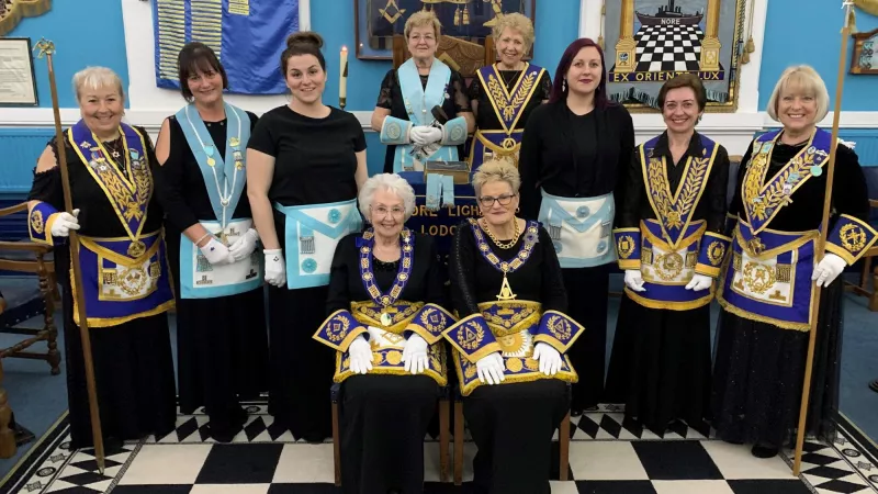 Women Freemasons wearing regalia