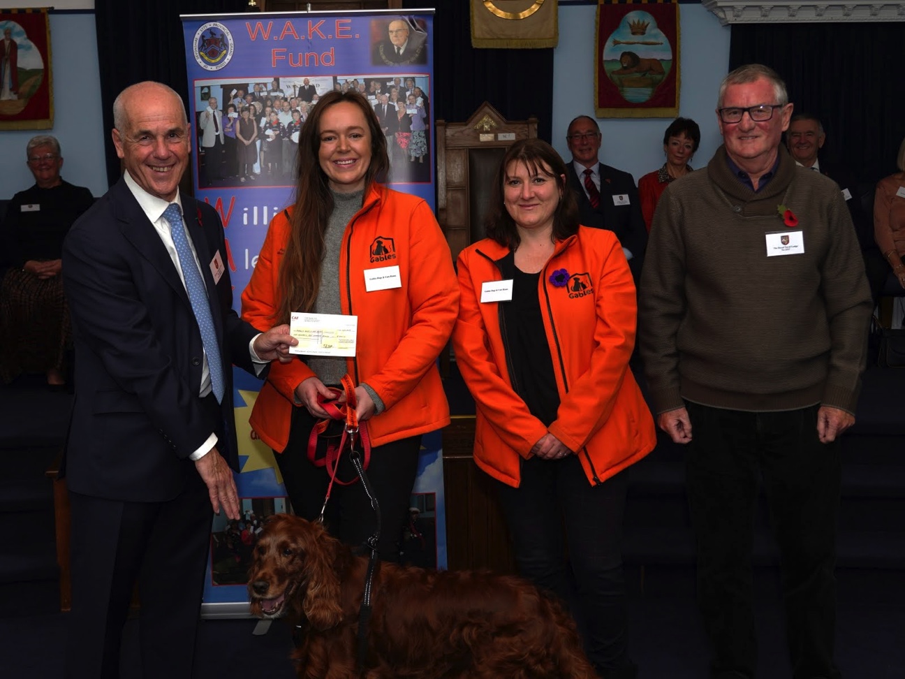 devonshire freemaons present a cheque