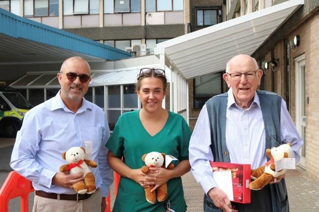 Tony Barrios, Sophie Barber and Jim Whitehead with the teddies of the charity Teddies for Loving Care