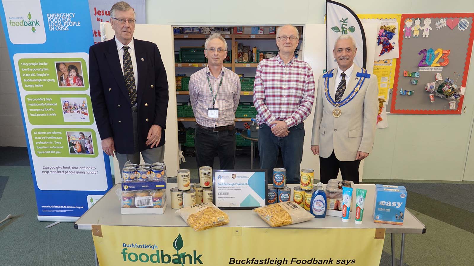 left to right: W Bro Clive Eden (Communications Officer Devonshire), Kevin Mitchell (Foodbank Manager), Richard Blight (Foodbank Volunteer), W Bro Andy Vodden (Assistant Provincial Grand Master Devonshire)