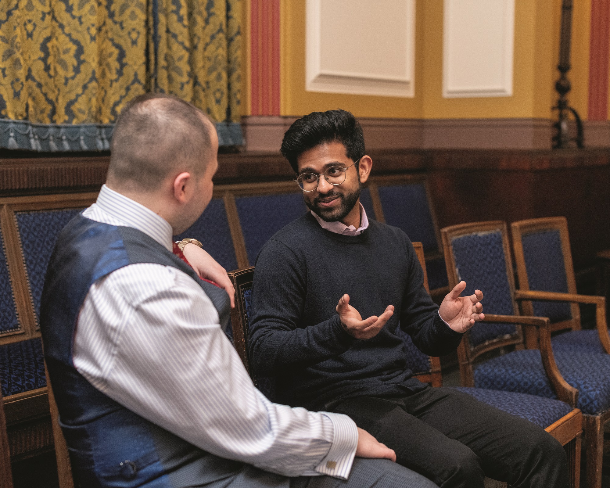 Young Freemasons talking in a Lodge room