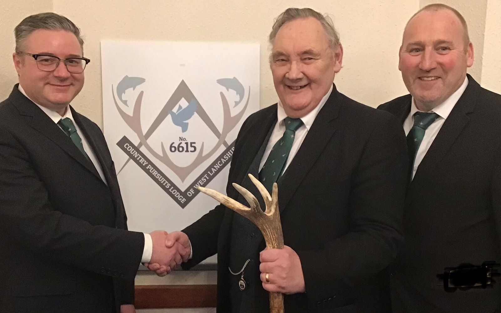 WM Mike congratulates the new initiate. Pictured, from left to right, are: Colin Hetherington (initiate), Mike Casey WM, Andy McClements