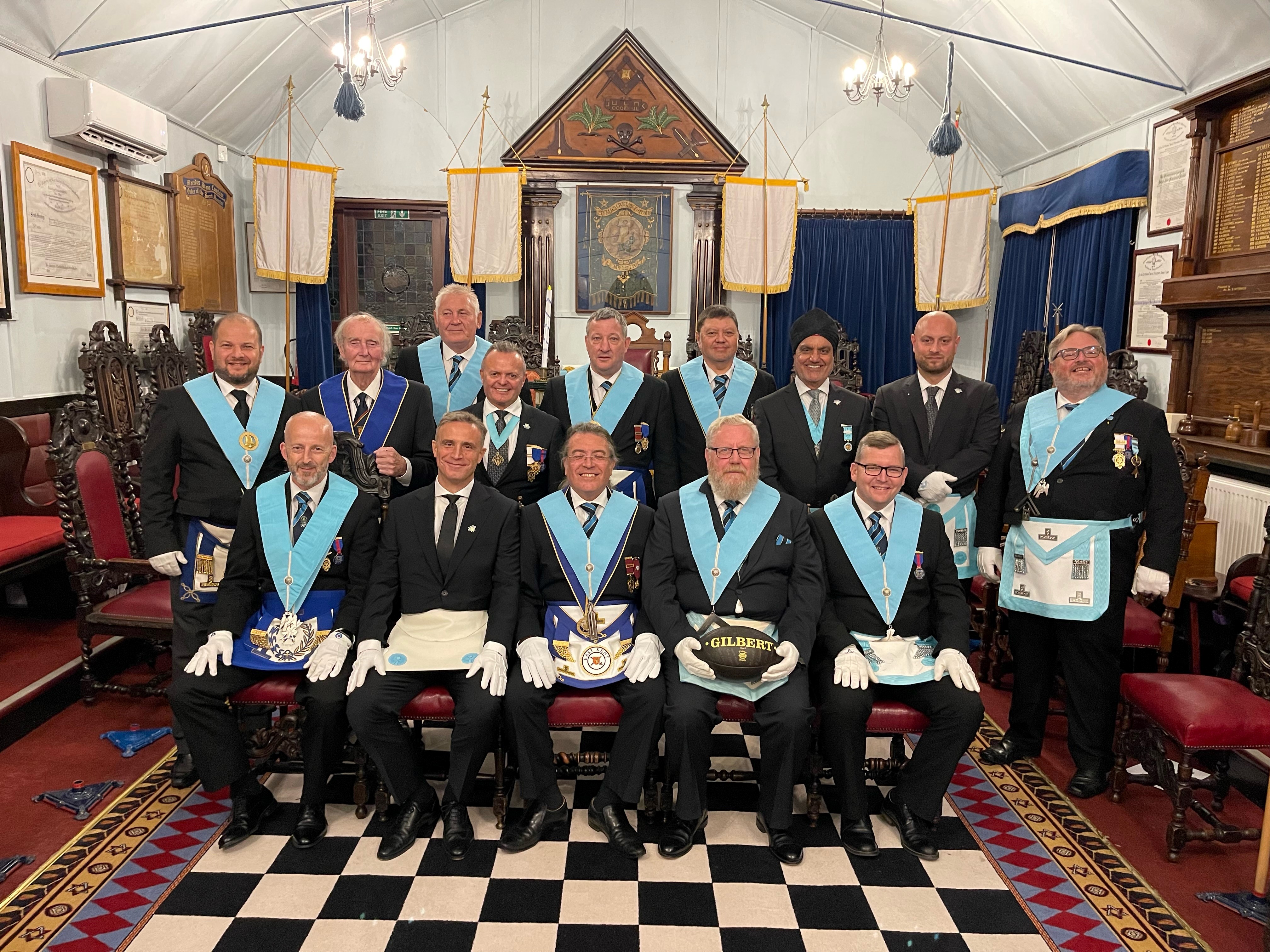 Freemasons in the Lodge in their distinctive regalia