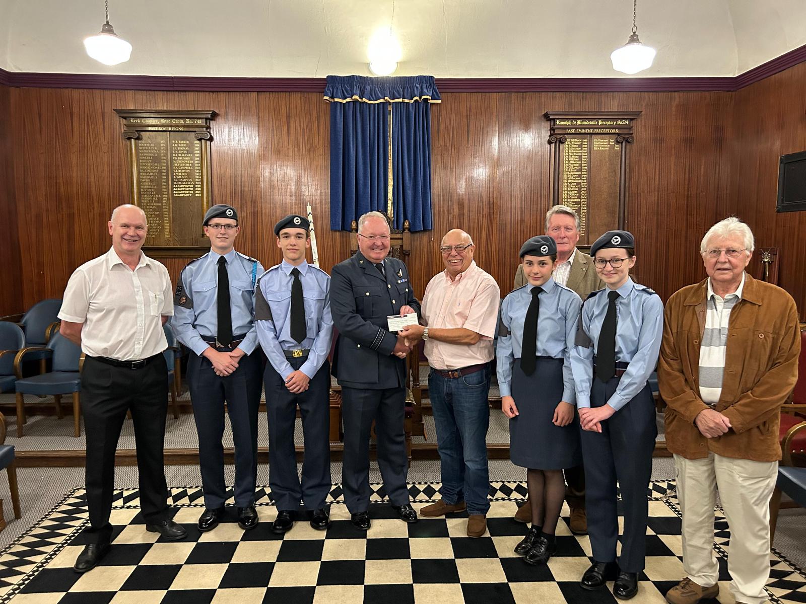 Members of 60 Leek Squadron Air Cadets receive a donation from Staffordshire Freemasons in the setting of the Leek Masonic Hall