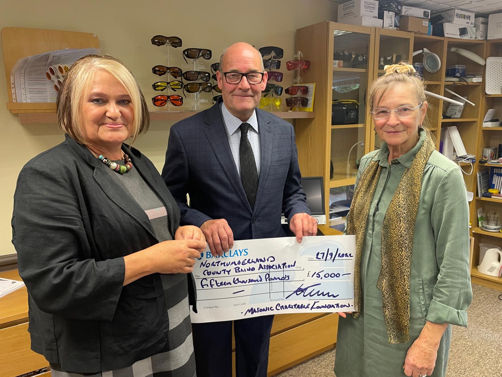 Cheque presentation L to R Julie, Ian, Mala.