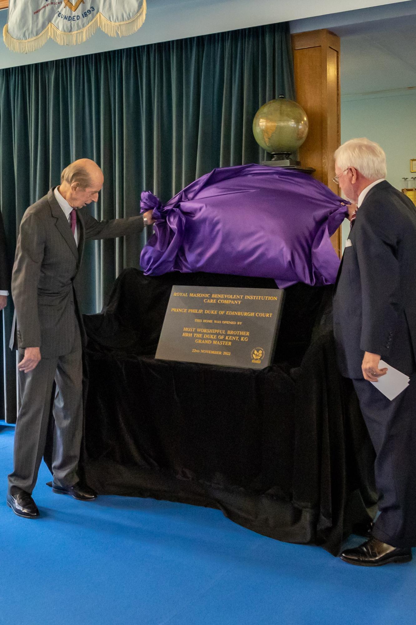 HRH The Duke of Kent and John Boyington CBE unveil the engraved stone together.
