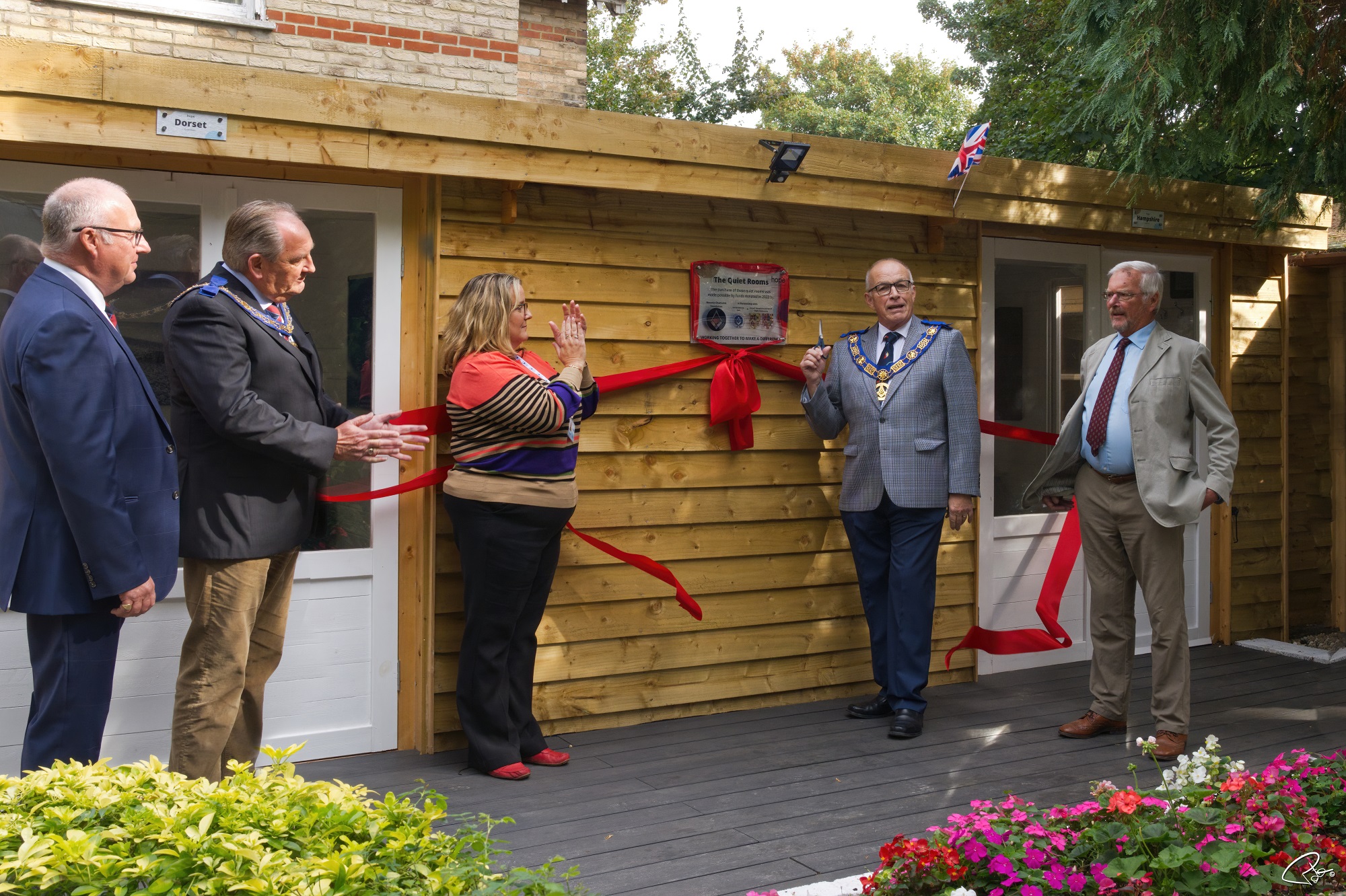 Freemasons from Dorset, Hampshire and the Isle of Wight cut the ribbon of the new counselling house 