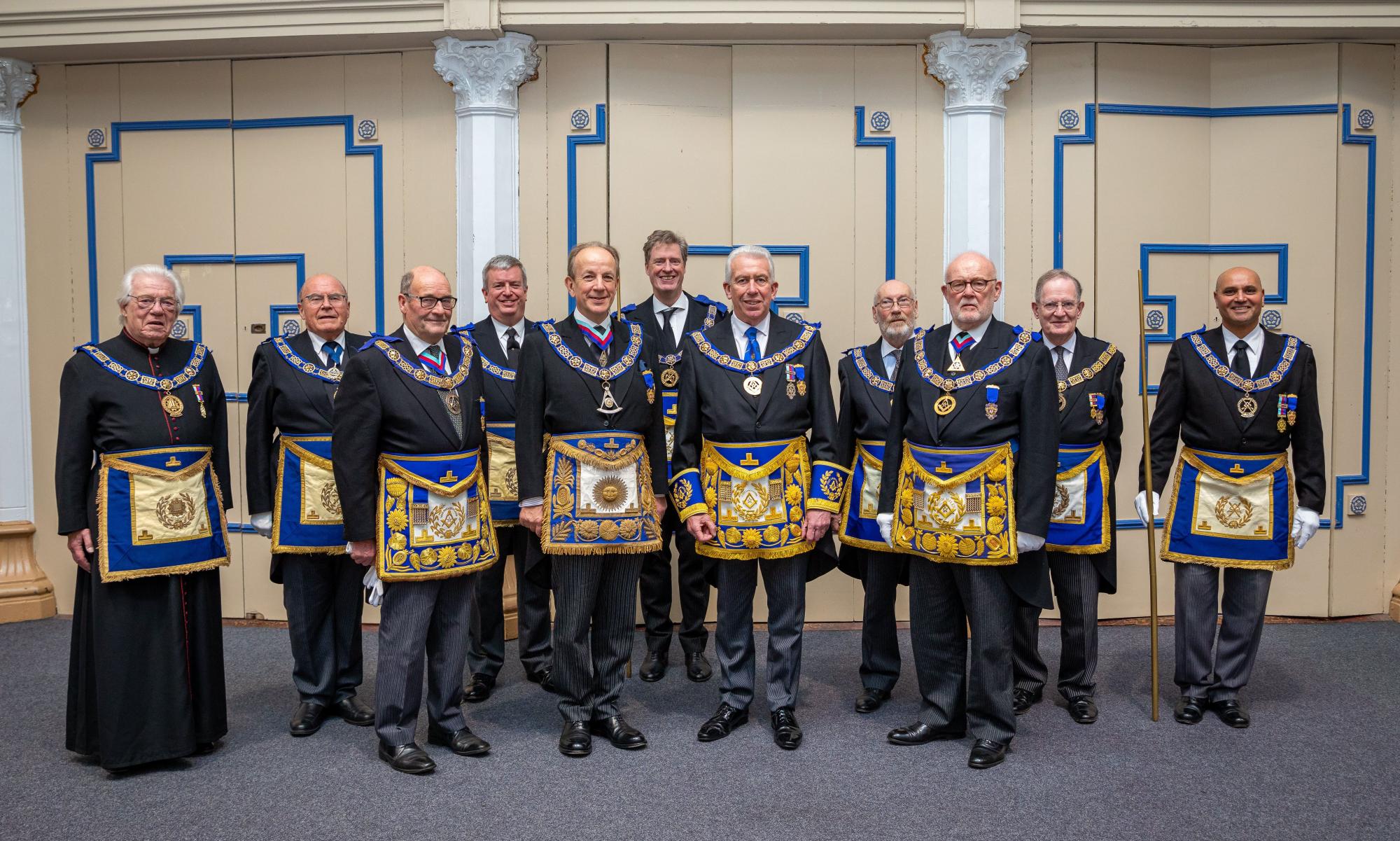 Mark Matthews (centre) surrounded by the team from UGLE