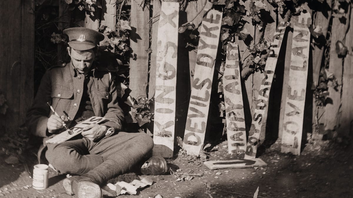 British Soldier Paints Trench Signs