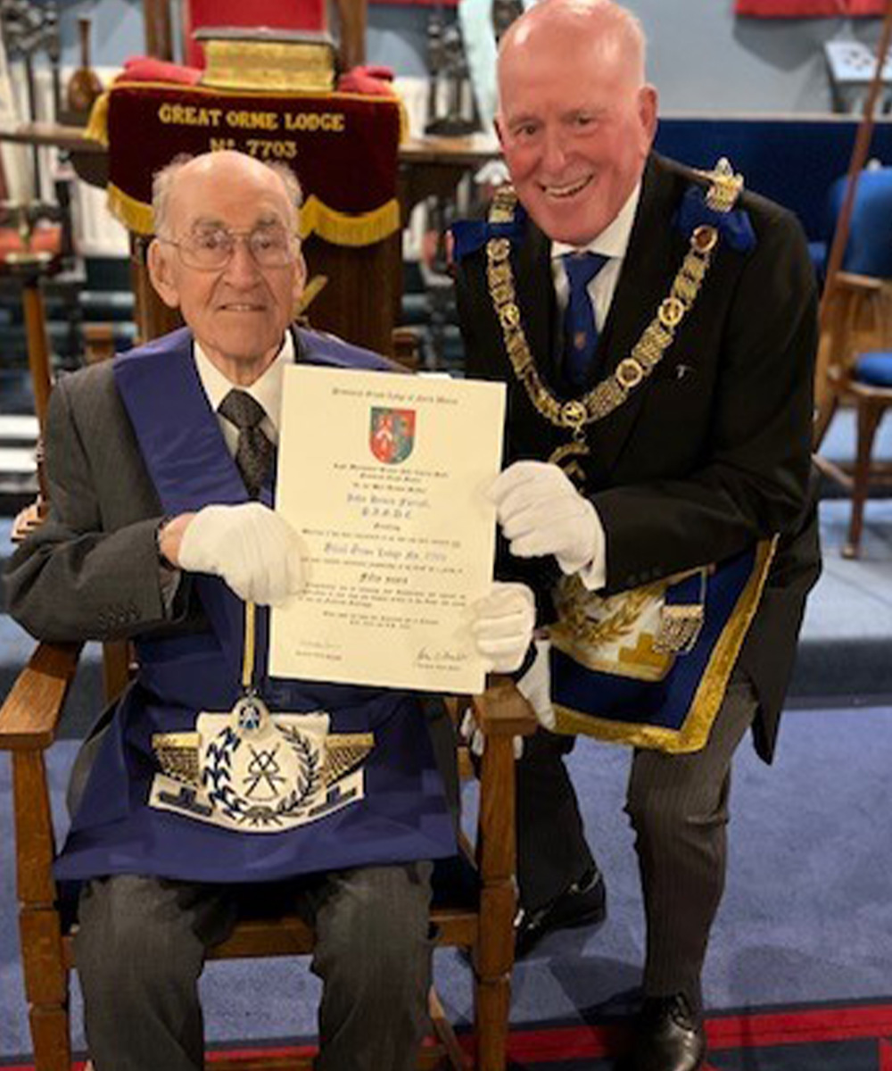John H. Farrall and the rest of the lodge with his long service certificate in full regalia.