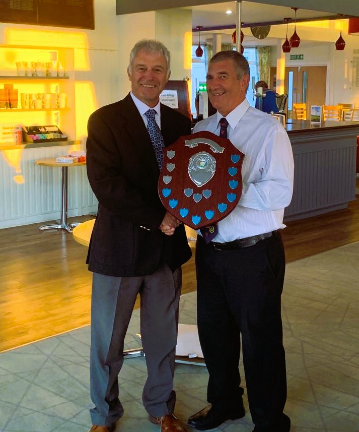 Dorset Fairway Lodge member with golf trophy