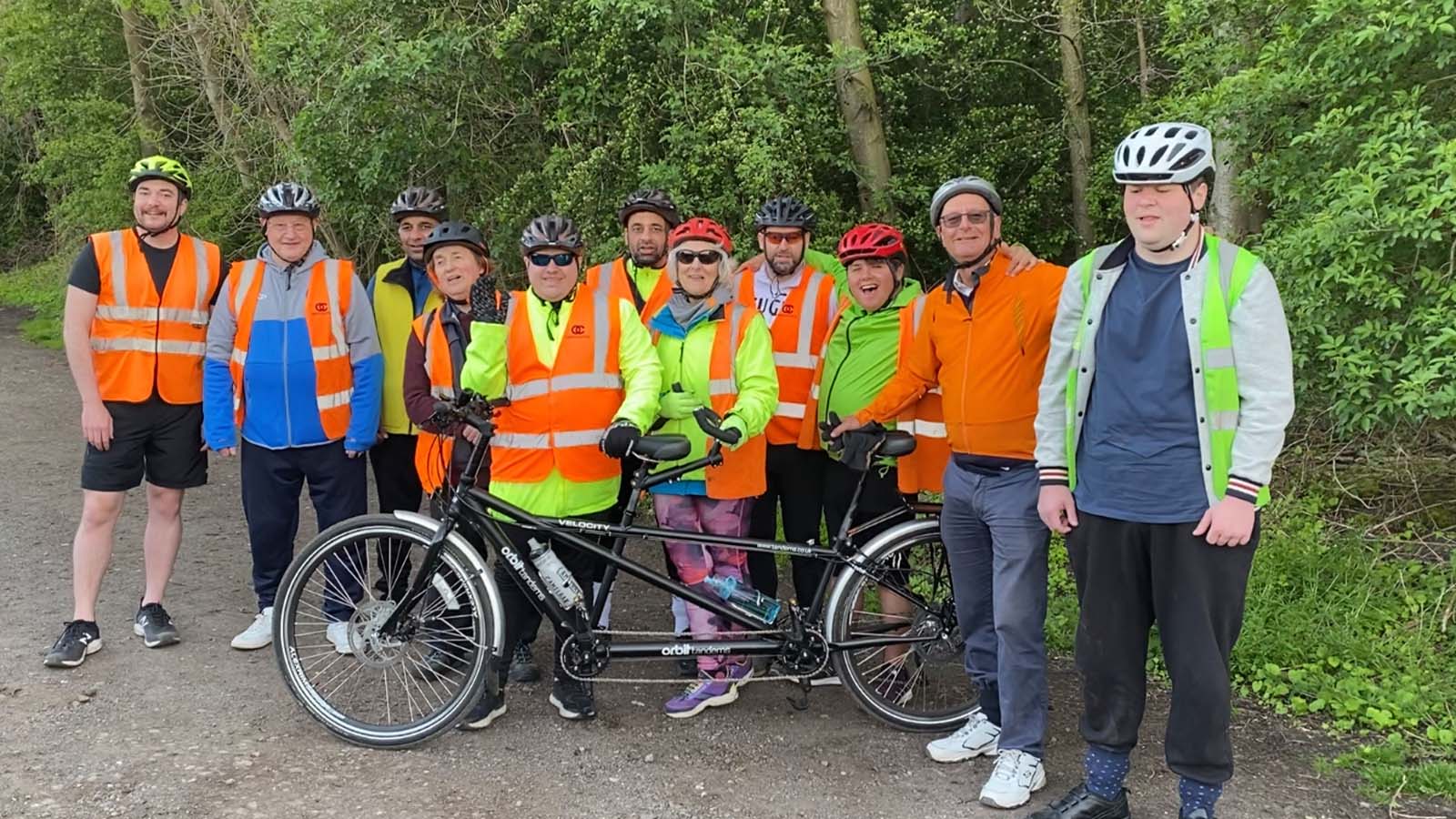 A group from Wakefield Open Country proudly show off their new tandem. 