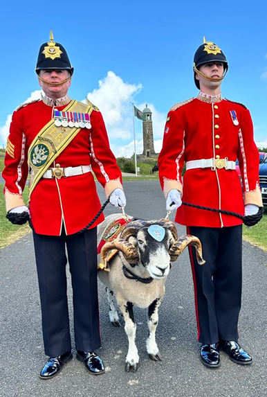 Members of the Armed Services and their mascot Lance Corporal Derby 