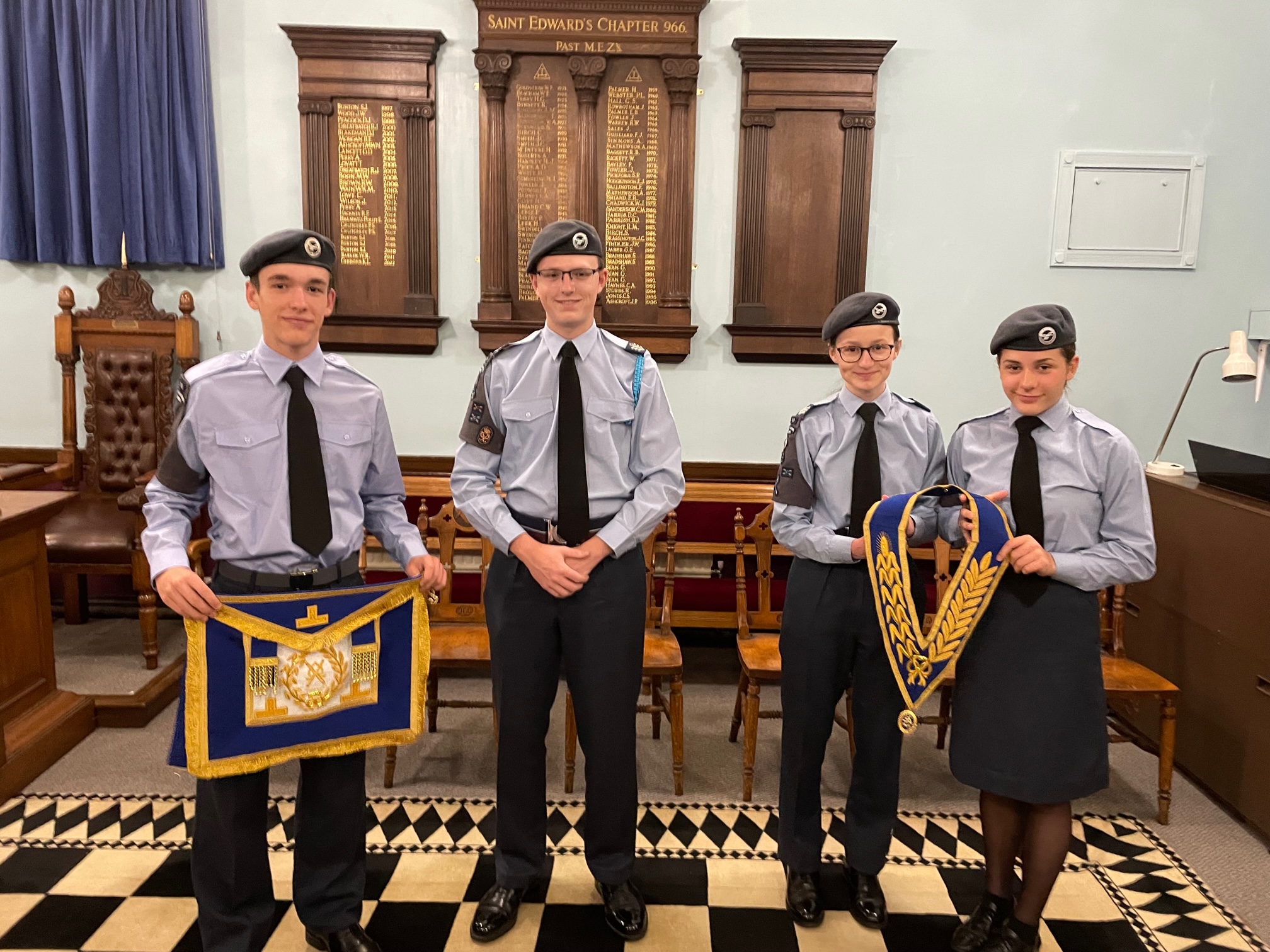 Members of 60 Leek Squadron Air Cadets enjoy a visit to the Masonic Lodge in Leek, Staffordshire and stand together holding masonic regalia