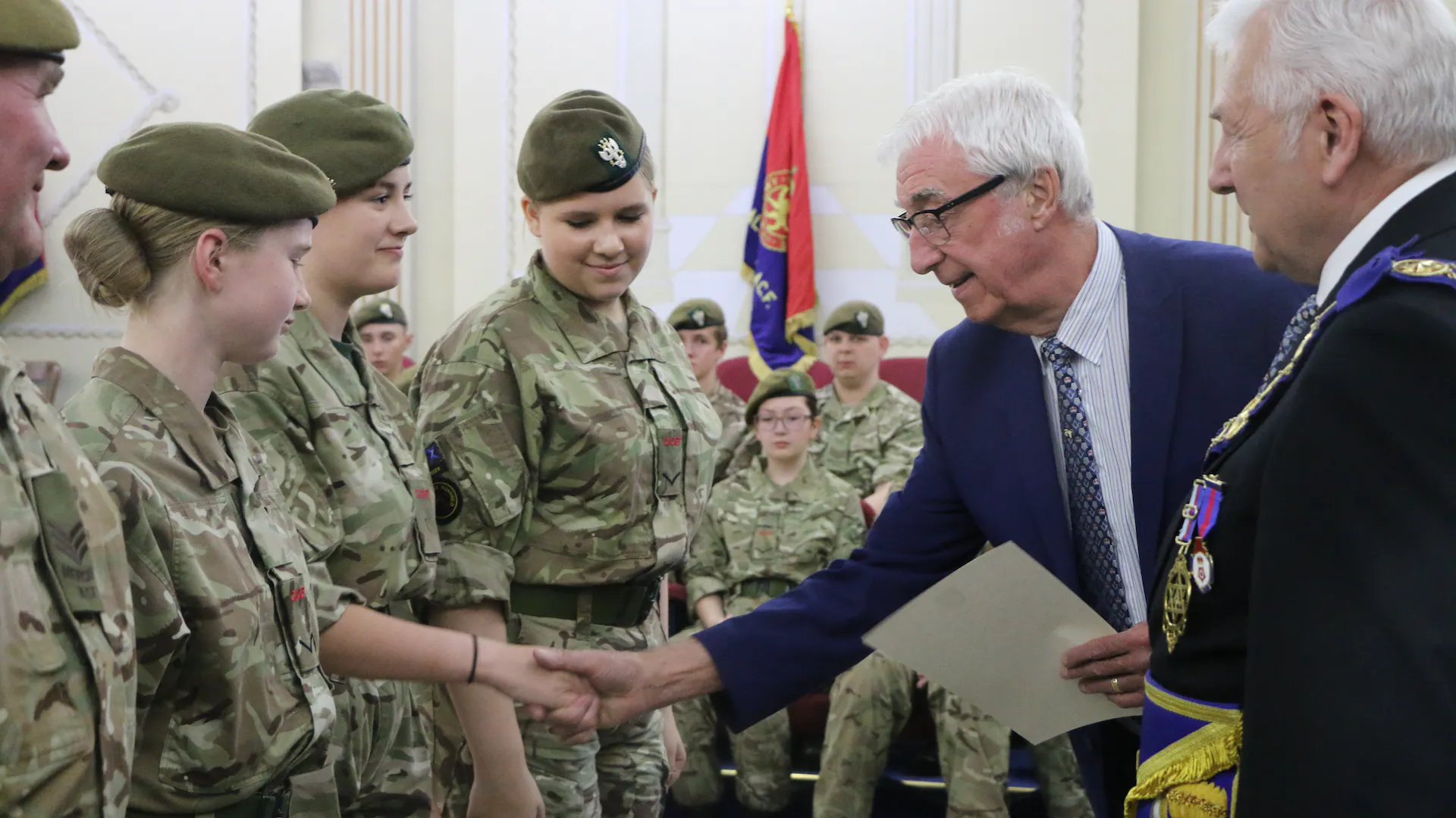 Freemasons giving army cadets their certificates
