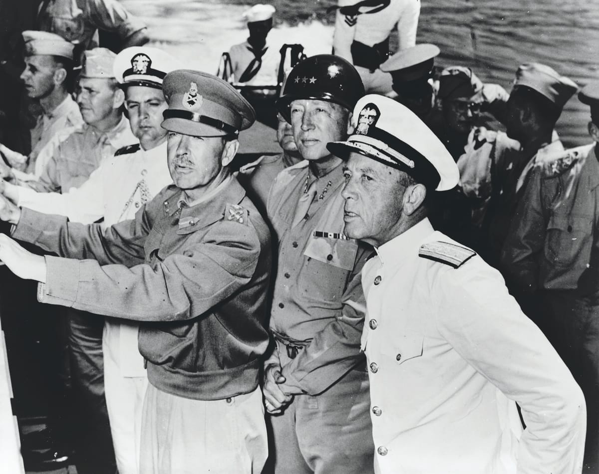 General Sir Harold Alexander, Commander of the 18th Army Group, with General George Patton and Rear Admiral Alan G. Kirk, July 1943