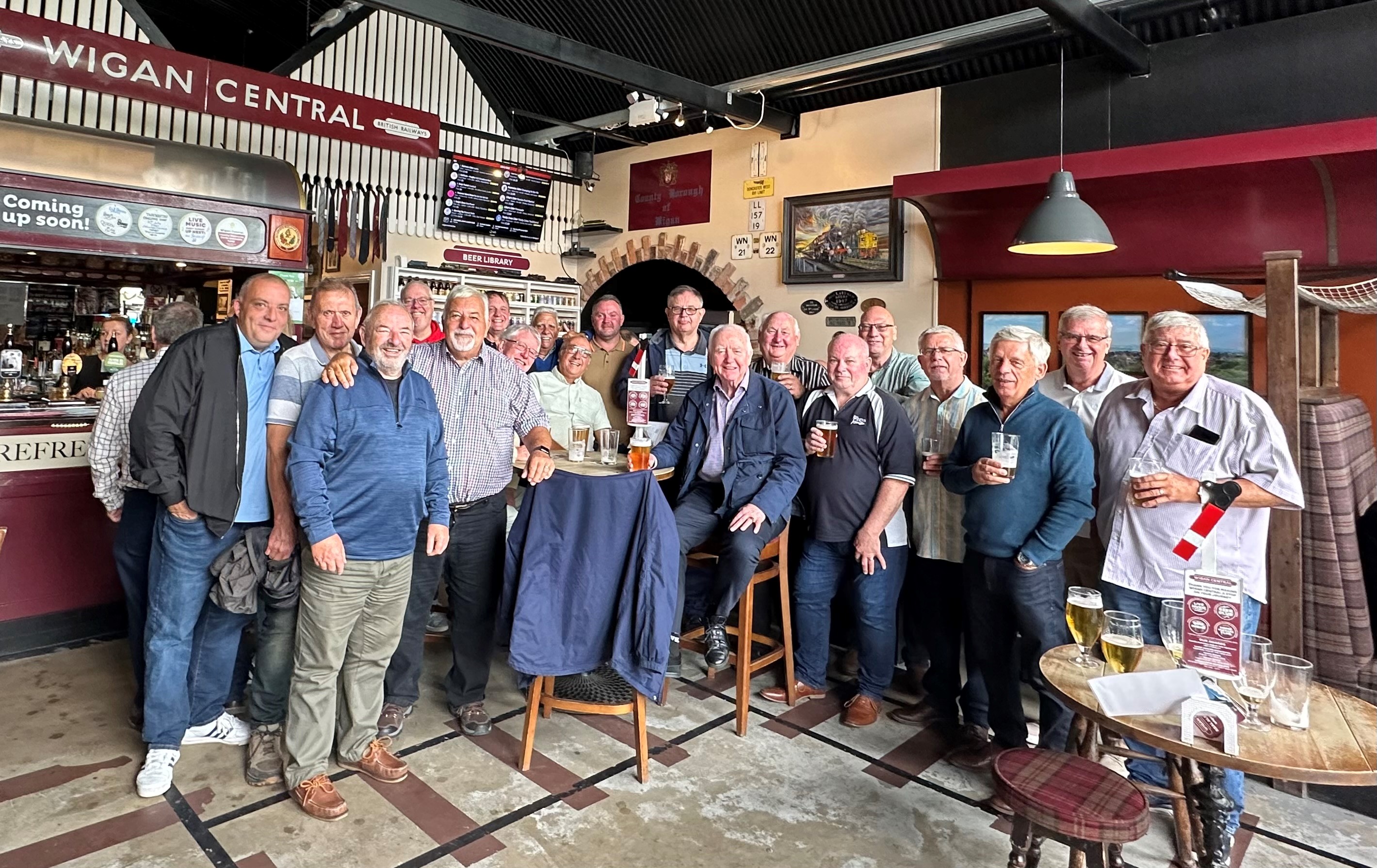 The sponsors gather before travelling to the match.