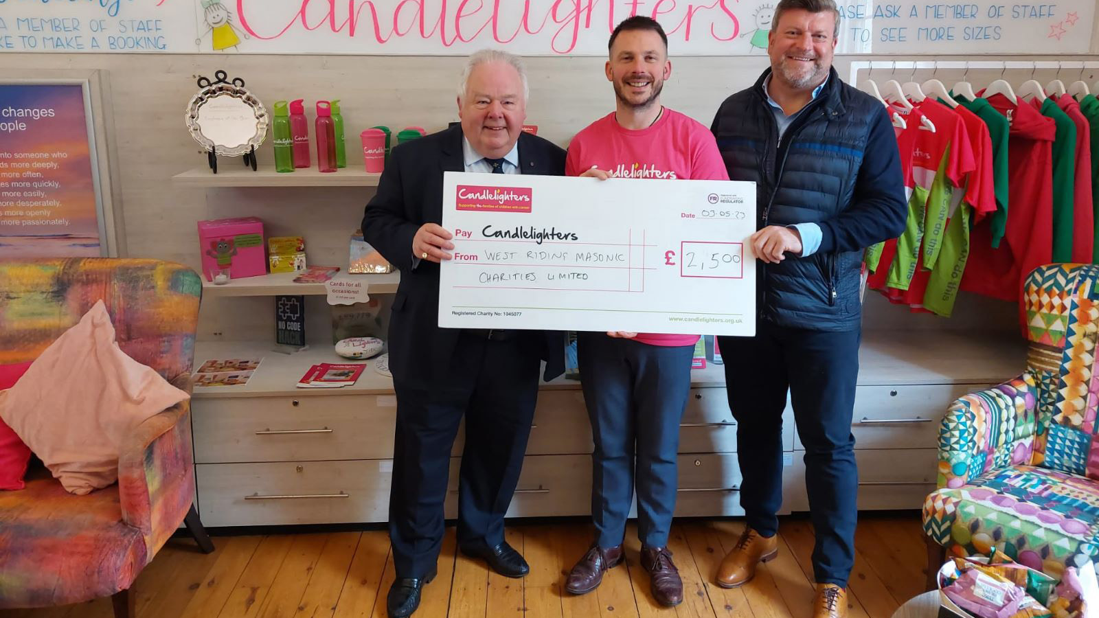 Presenting the cheque to The Candlelighters. Pictured left: Keith Madley (The Leeds Lodge), Chris Salt Candlelighters) and Simon Penny-Smith (Leeds Lodge).