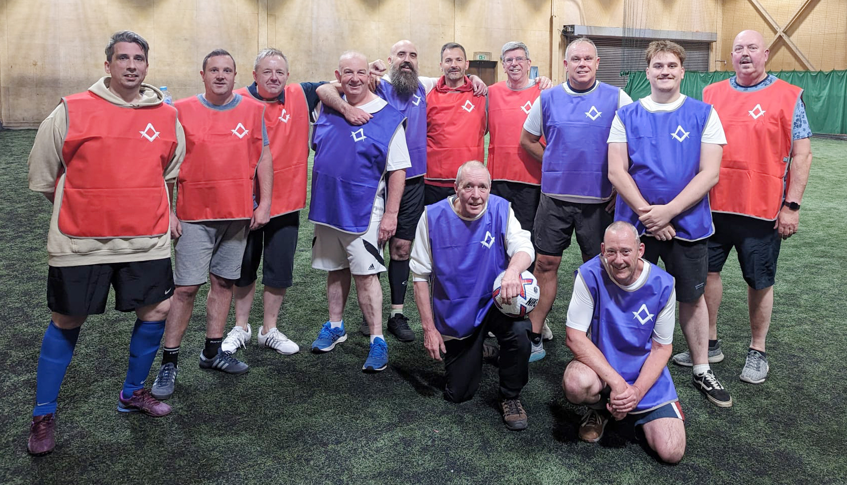 PITCHING IN: Pilgrim Fathers Lodge players are in the purple bibs, with Lindis in red.
