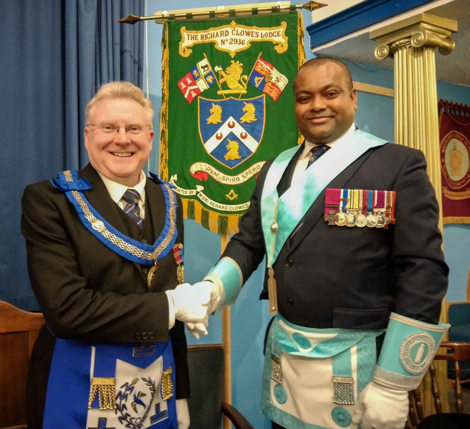 Mark Smith and Johnson Beharry VC in a Freemasons Lodge wearing regalia