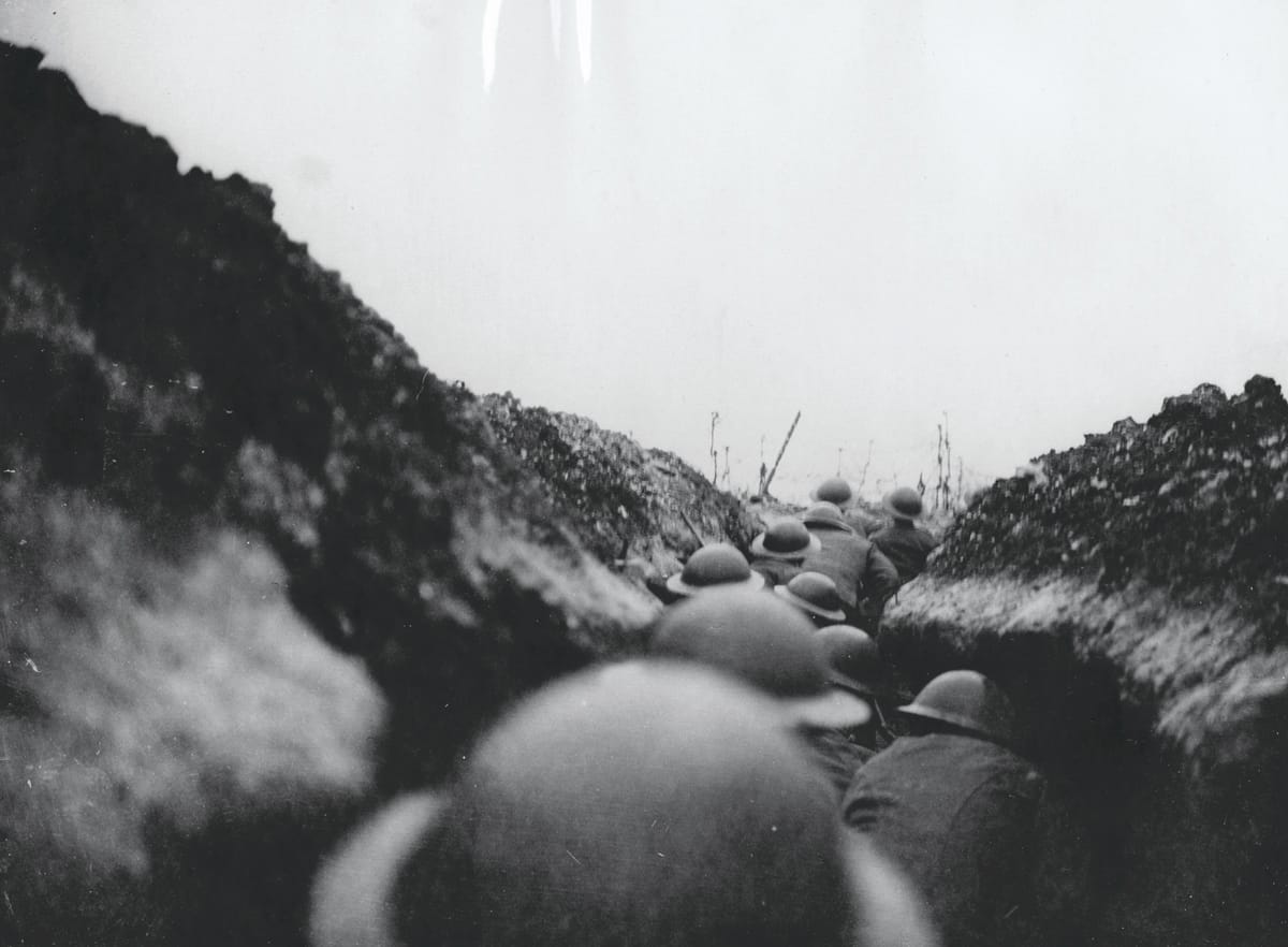 A raiding party of the 10th Battalion Cameronians (Scottish Rifles) waiting in a ‘sap’ trench for the signal to go. Moments later a shell fell short killing seven men, c.1917