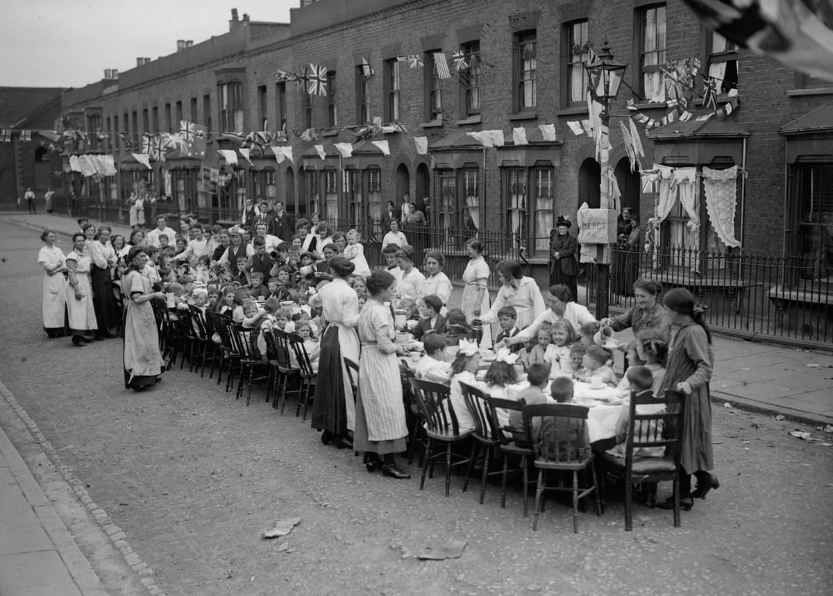 A children’s tea party in an East End Street, London, celebrating the Treaty of Versailles, c.1919