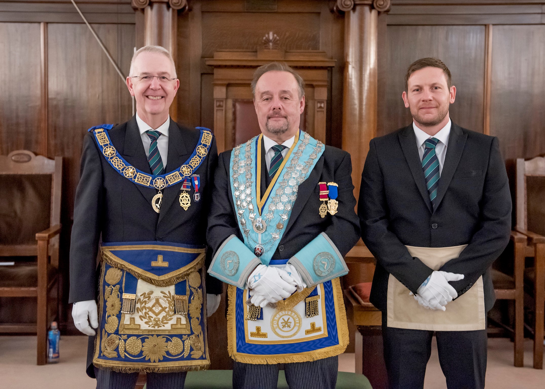 Provincial Grand Master of Worcestershire stands with other two Freemasons during a four ceremonies in a day event