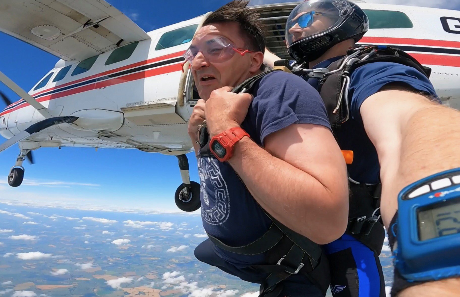 Shows PGM Jolyon Berry exiting the light aircraft