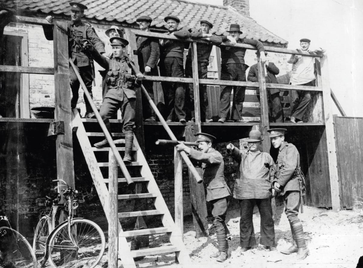 Soldiers and civilians on east coast of England keeping watch for enemy ships, c.1917