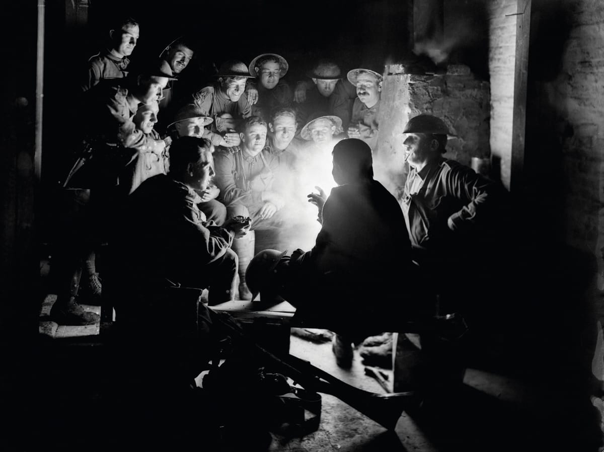 British soldiers gathered around a lamp