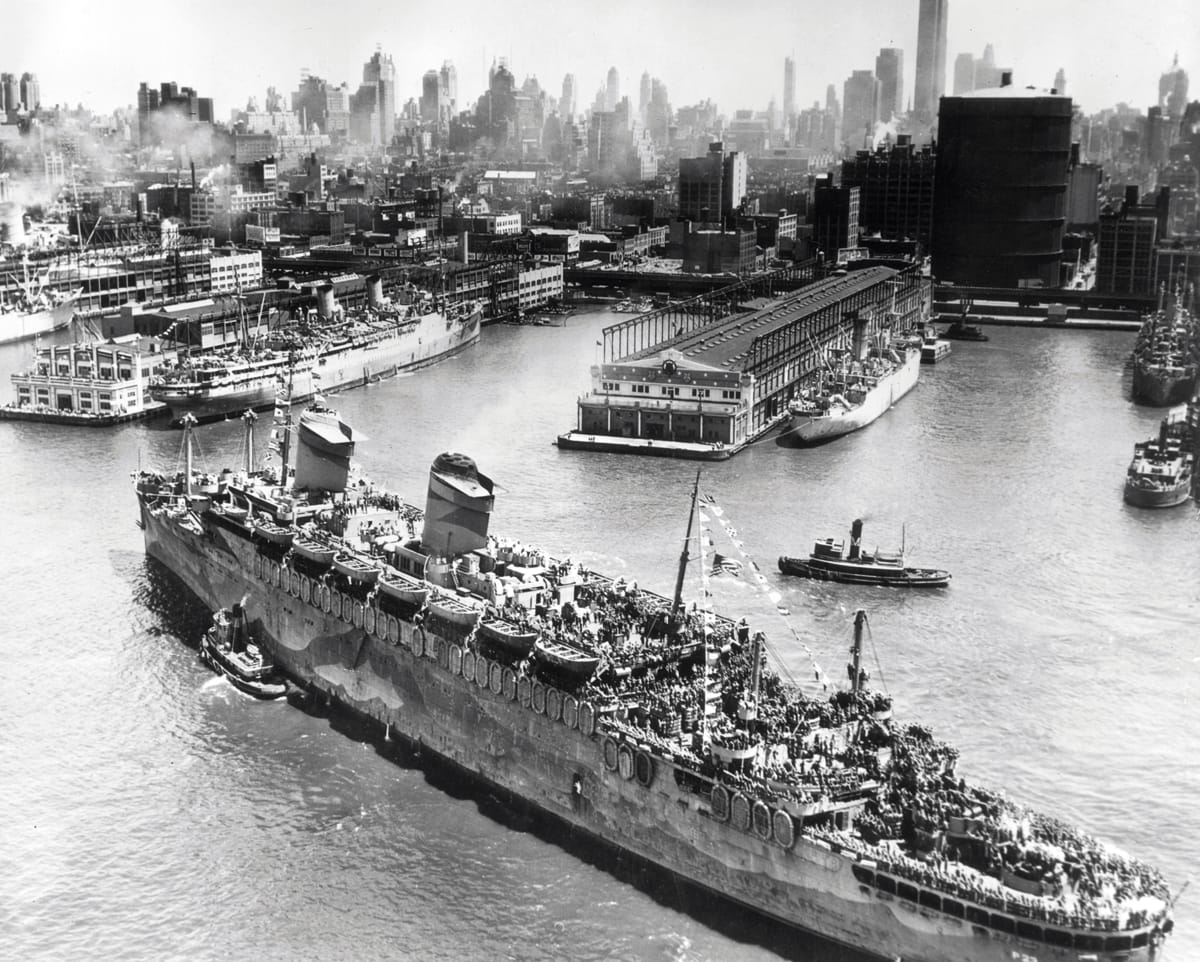 High angle view of a transport ship full of American troops arriving in New York City at end of WWI c.1919