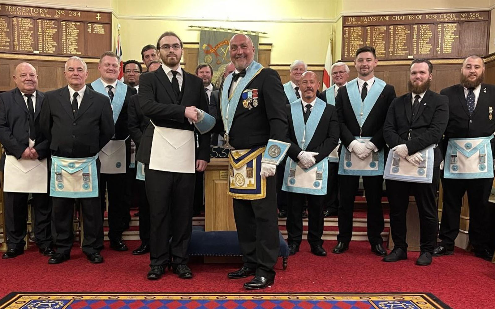 Lewis being initiated into his fathers lodge.