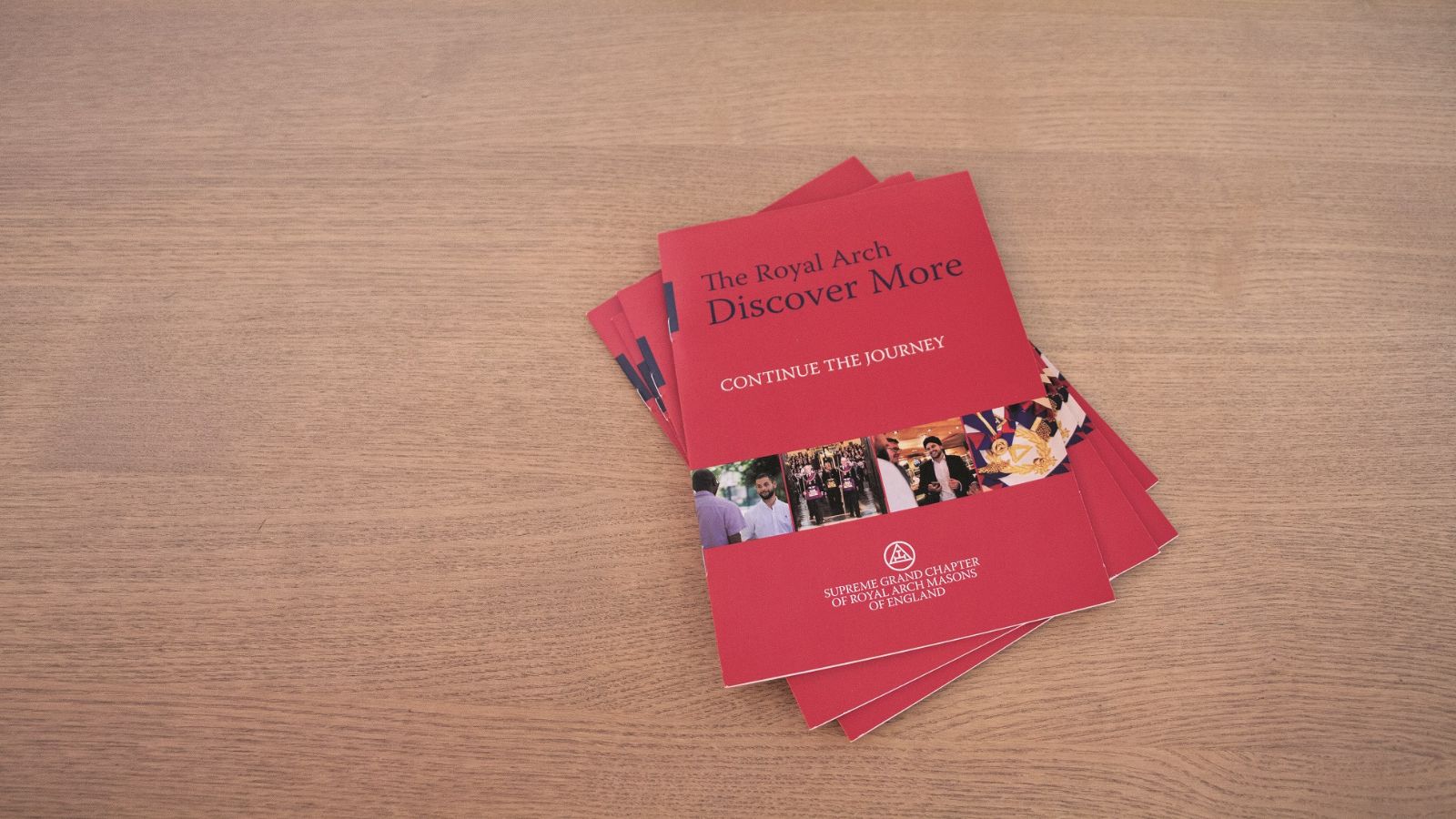 Red booklets titled 'The Royal Arch - Discover More'