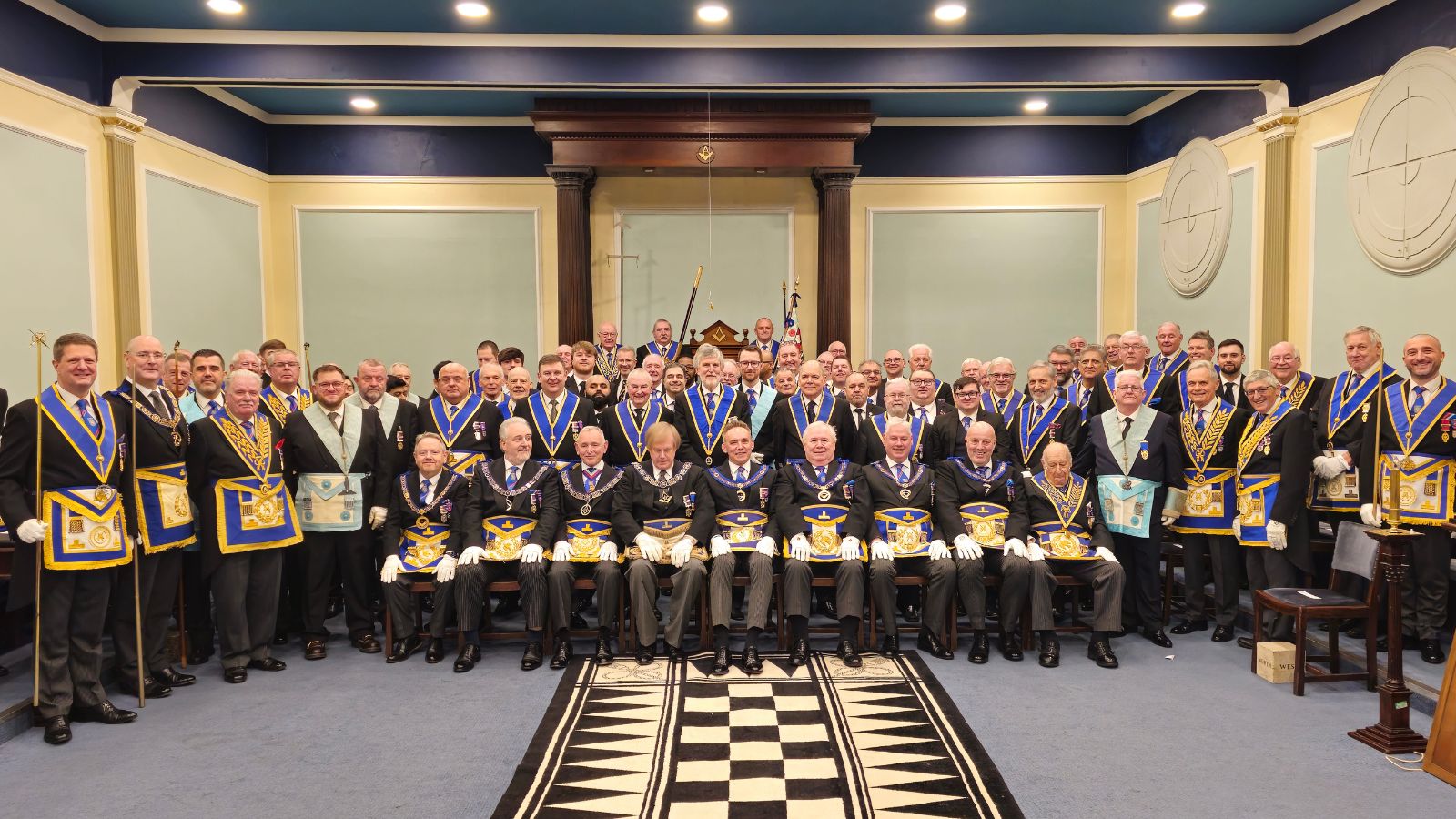 Freemasons of the University of Manchester Lodge in their regalia
