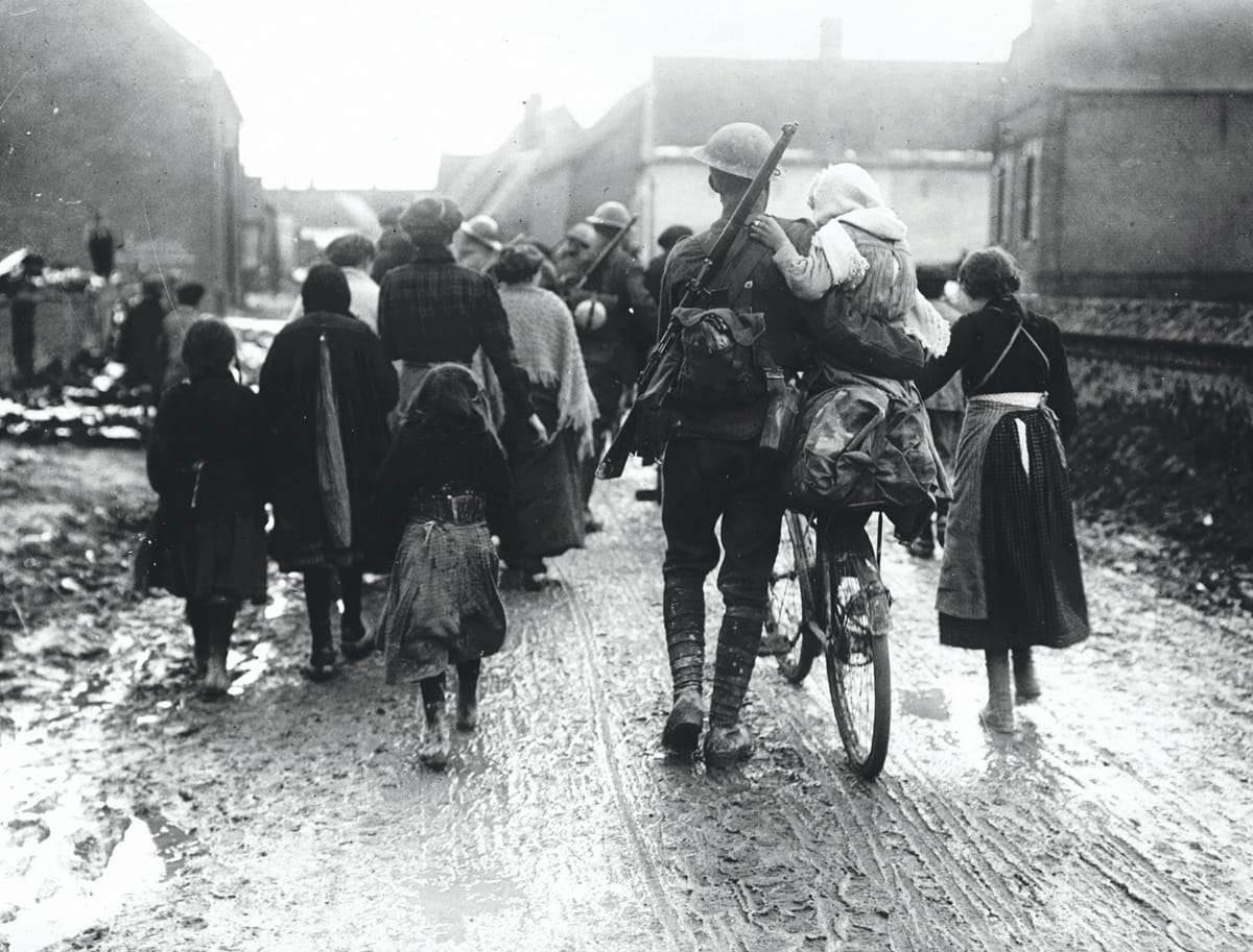 Villagers Greet British Troops