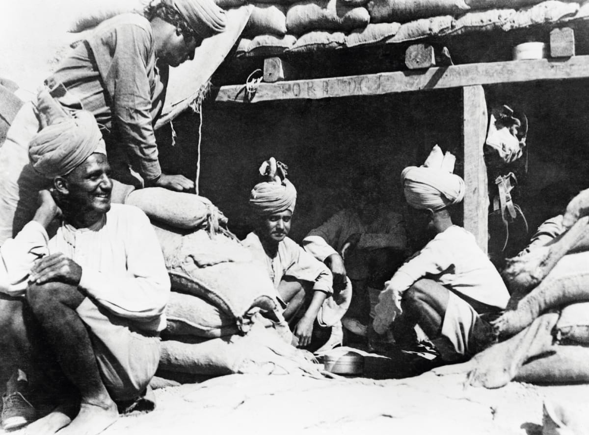 Desert Men of the 123rd Outram’s Rifles sitting outside their dugout in Palestine, December 1917 George Westmoreland/IWM via Getty Images