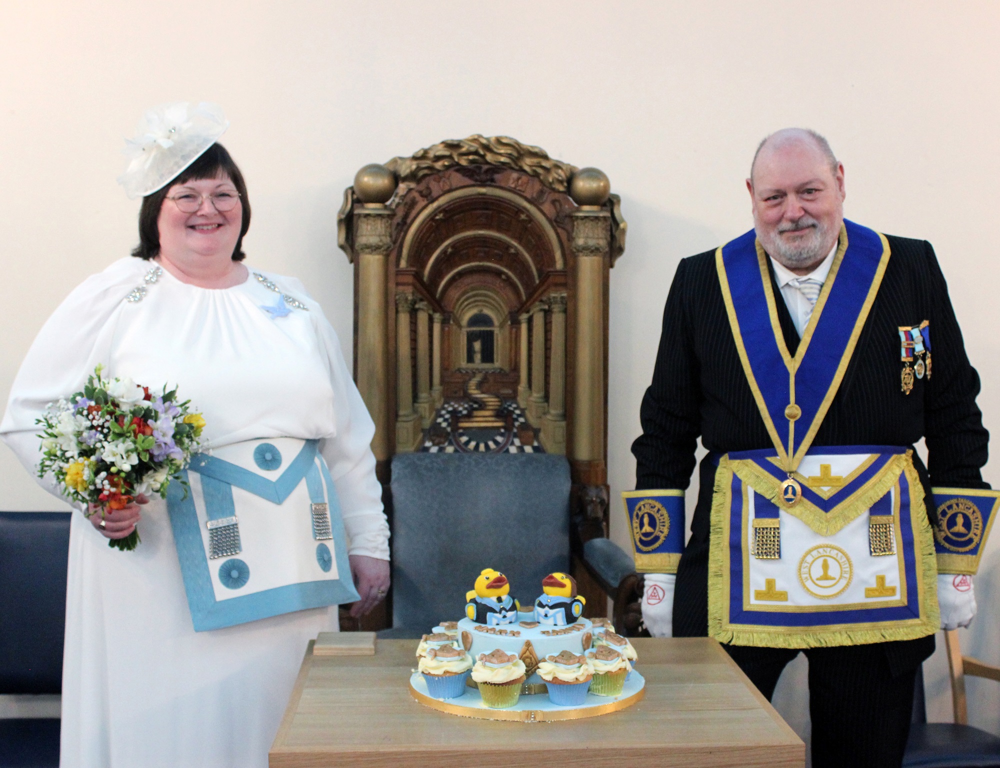 Mark and Tanya on their wedding day, both dressed in their Masonic regalia