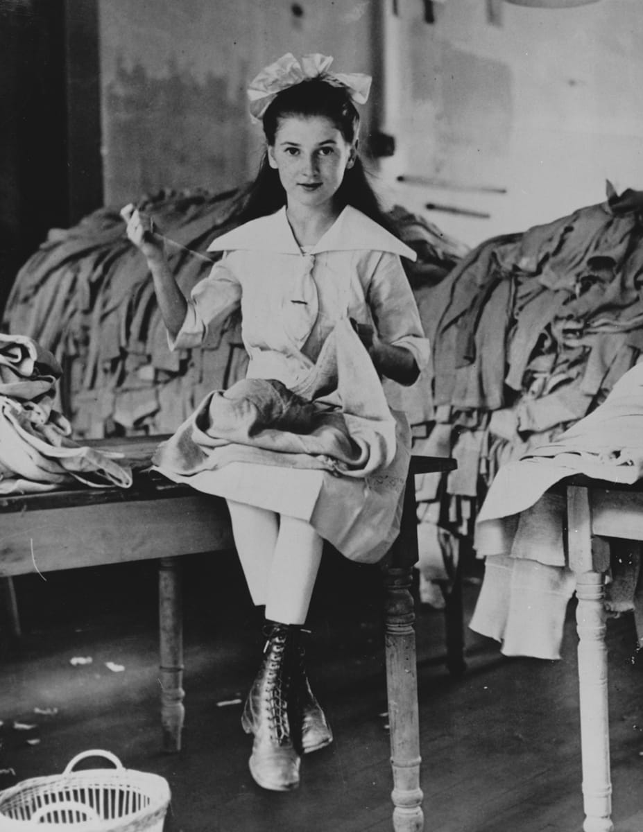 World War I Worker sewing coats for soldiers