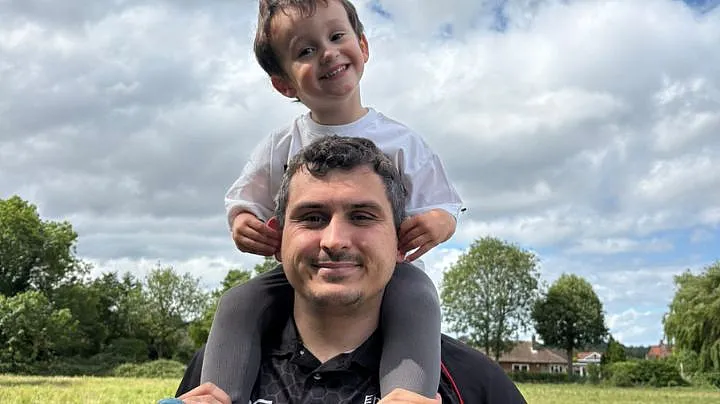 Jake Huggett with his son