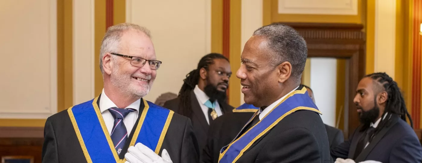 Two Freemasons talking after a Lodge meeting