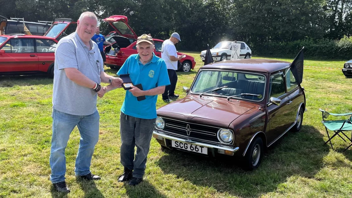 Judges Favourite award presented by Monmouthshire Deputy Provincial Grand Master Chris Evans to the owner of a 1977 Mini Clubman