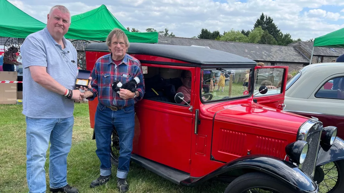 Chris Evans awards the owner of a Austin 7 Red Van