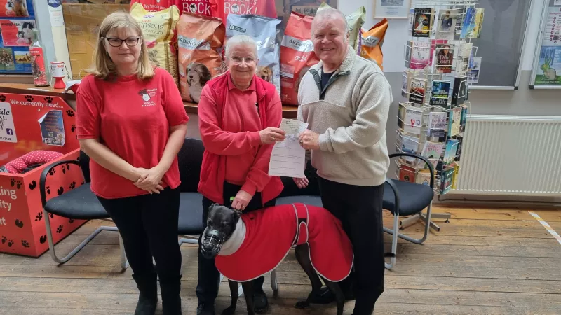 two volunteers of the trust being given the donation from the plymouth freemasons