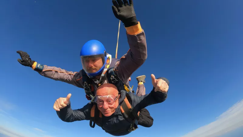 Freemason David Armstrong flying with a parachute 