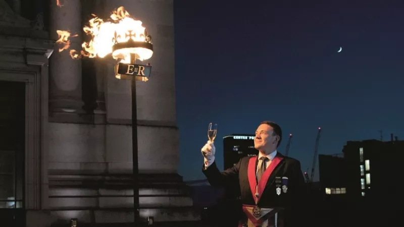 Freemason Dr Jake Mossom lights and toasts the Hubilee beacon at Freemasons' Hall on 2 June