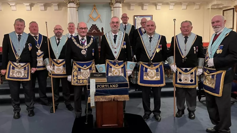 A group of freemasons in full regalia