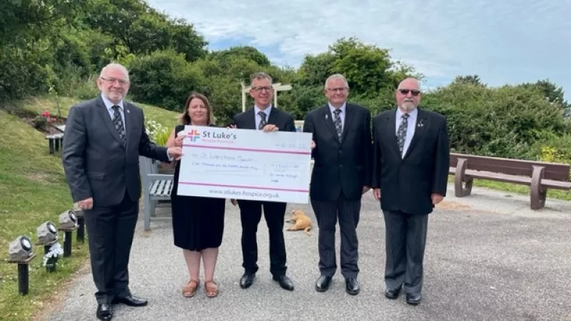 Bryan Elms, Andrew McConaghy, Phil Collins, Paul Stephenson present a cheque to Sarah Willis, Partnership Lead of St Luke's Hospice