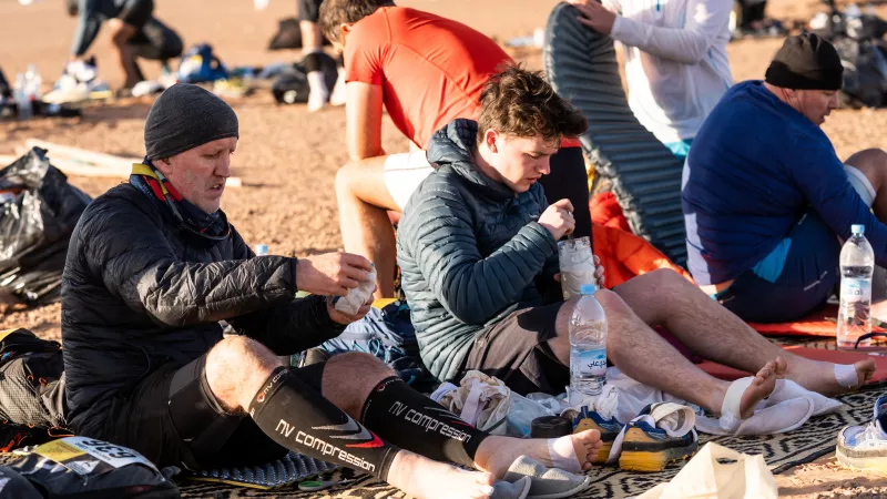 Ian (left) and George are pictured resting at the start of the second day. Picture by curtesy of Ian Corless