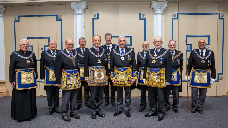 Mark Matthews (centre) surrounded by the team from UGLE